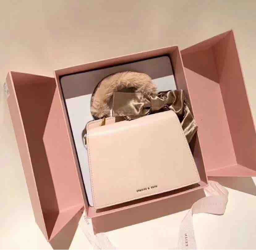charles and keith pink fur bag